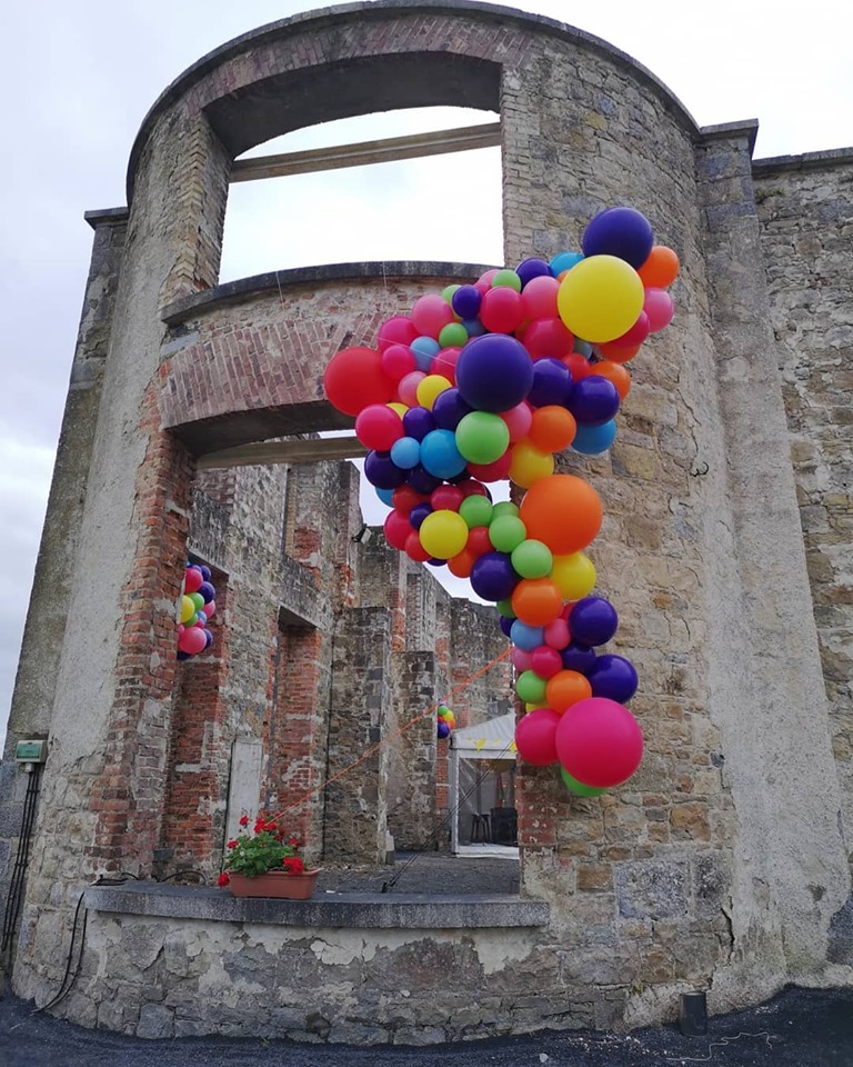 colourful balloon cluster from window