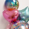 happy birthday balloon bunch with disco orb close up