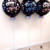 three gender reveal balloons