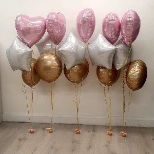 pastel pink hearts and white and gold balloon bunches