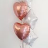 white and rose gold balloon bunch