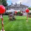 red 3ft balloons on poles with tassels