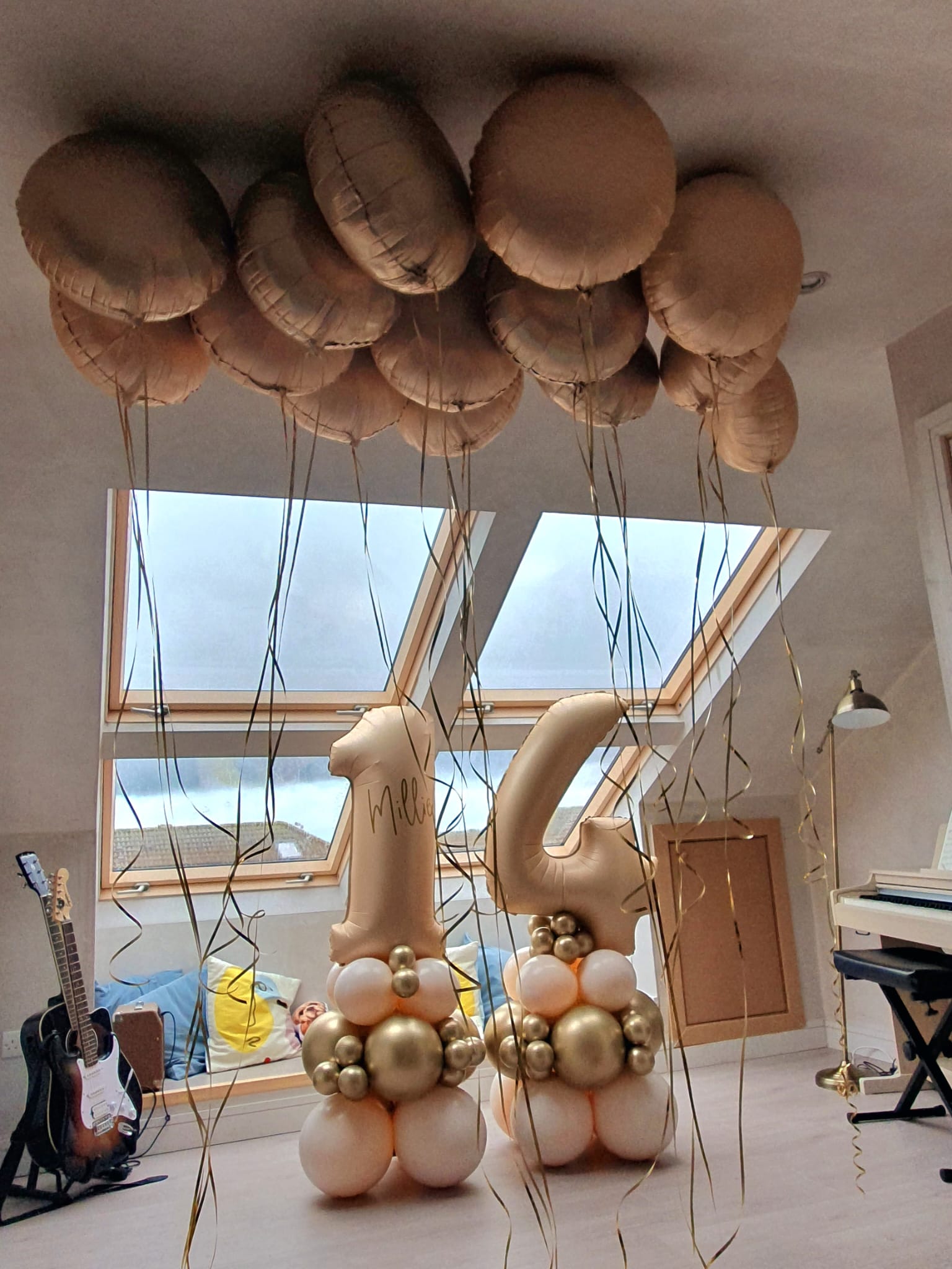 Nude balloon stacks with ceiling balloons